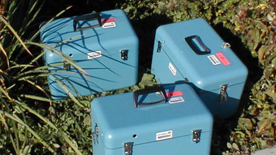 Three light-blue containers with handles