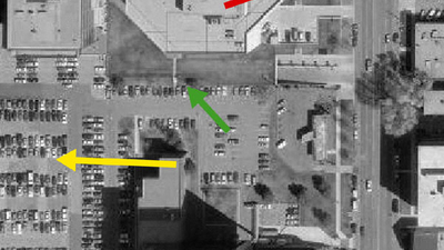 Aerial view map of several building with several colored arrows pointers 